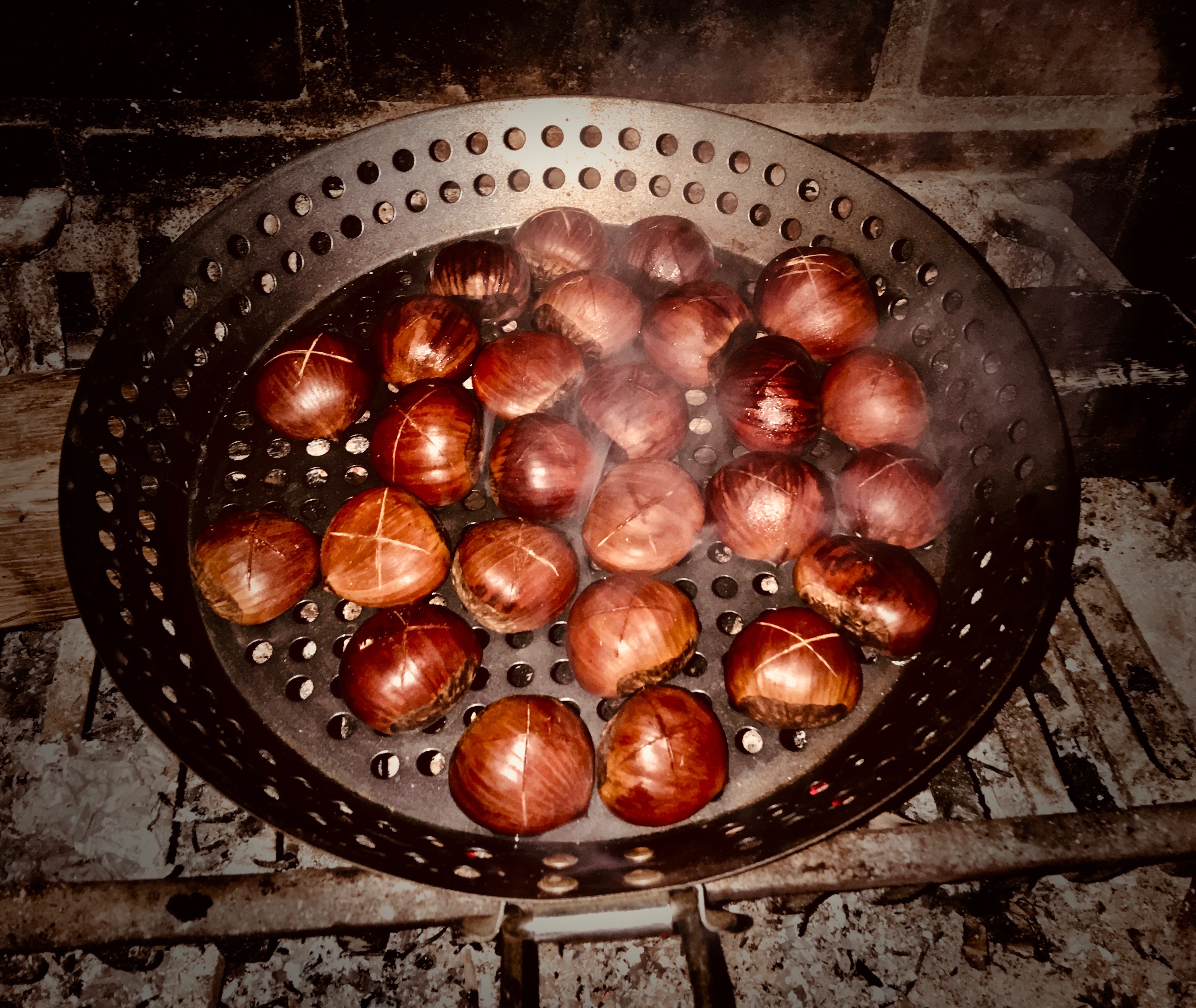 chestnuts on fire in a pan