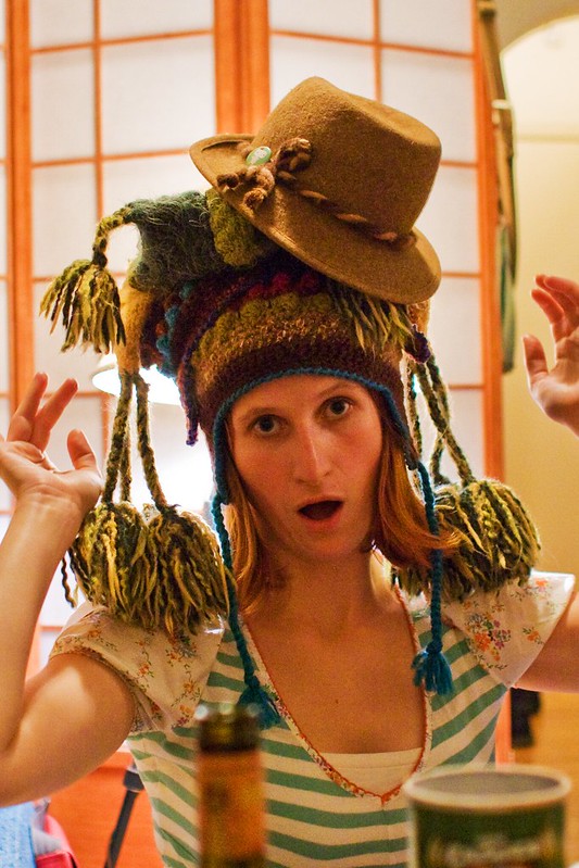 personal photo of a woman wearing 2 or 3 different types of hats